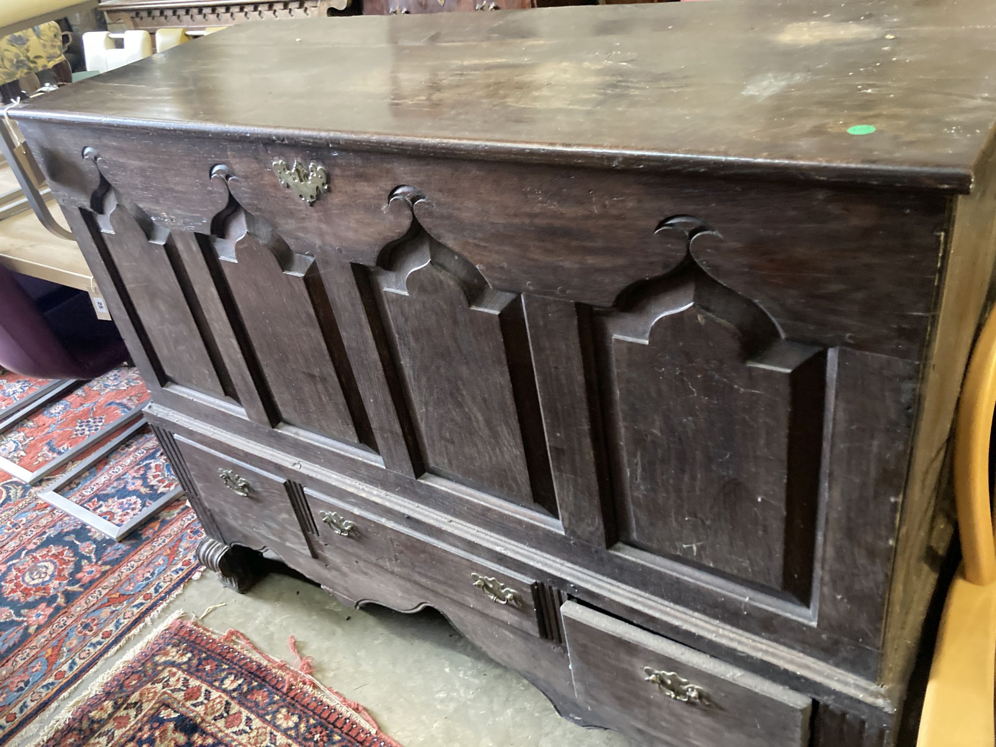 An 18th century oak mule chest, width 140cm, depth 56cm, height 110cm